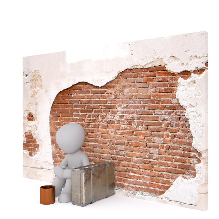 white male poverty and brick wall