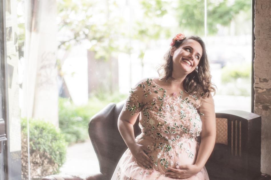 pregnant woman in a beautiful dress on the terrace