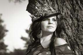 A Beautiful Woman In A Hat With Flowers