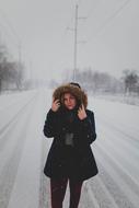 woman on Snowy Road Path