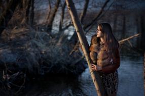 Beautiful girl in front of the river