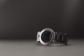 Black Face wristwatch at blur grey background