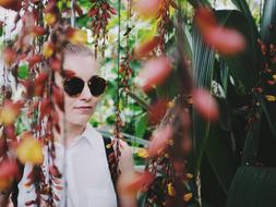 Girl wearing sunglasses in garden outdoor