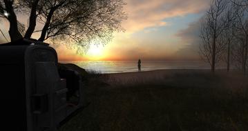 woman looks at sunset from beach