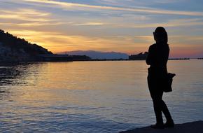 female silhouette at Sunset Sky