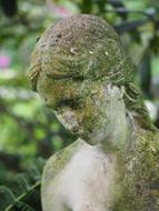 stone mossy Statue Girl Face
