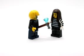 two male and female Lego Toys