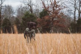 girl in a black hat on a cereal field