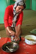 happy Young woman Cooking, Afghanistan