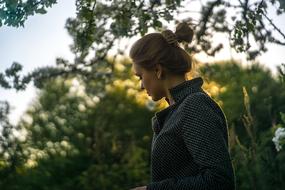 young Girl beneath tree at dusk
