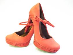 orange high heel shoes on white background