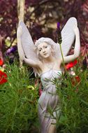 garden white statue of a fairy woman with wings