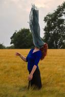 lady with scarf on the field