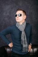 male model in a scarf and sunglasses