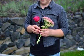 flowers in hand of young man outdoor