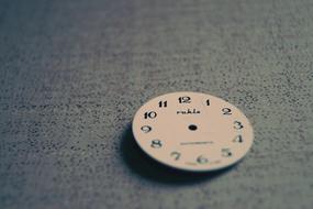 vintage Clock face on grey surface