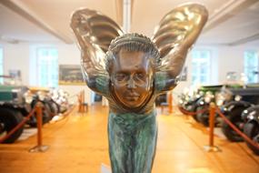 angel statue at a car show