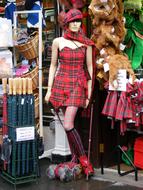 Female Mannequin in red clothing in shop