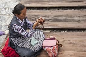 praying woman in a buddhist temple