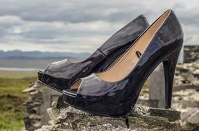 fashionable stylish shoes on the top of the mountain close up