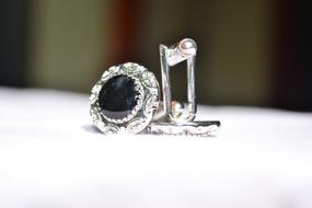 silver cufflinks with black stone close up