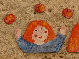 children's picture of a girl juggling with apples