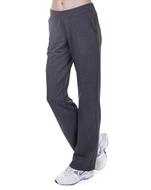 Black sports pants on the woman's legs, at white background