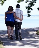 couple in love walks along the sunny coast