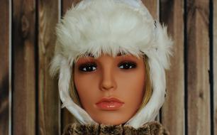 doll in a white fluffy hat