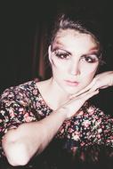 Portrait of the beautiful, posing girl on the hands, in colorful dress