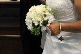 bride with white wedding bouquet