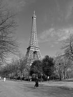 black and white photo of a girl on the background of the Eiffel Tower in Paris