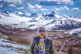 young man on a background of mountains