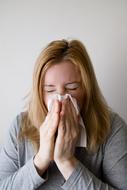 caucasian Woman Blowing Nose