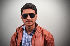 young Indian Man in black sunglases