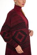 girl in a burgundy sweater with a Kazakh pattern