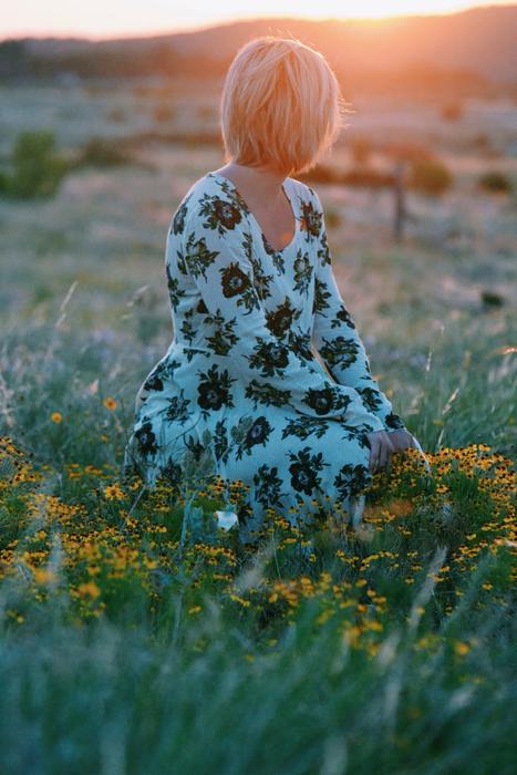 Woman Sitting Field