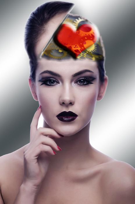 young woman with heart symbol on forehead