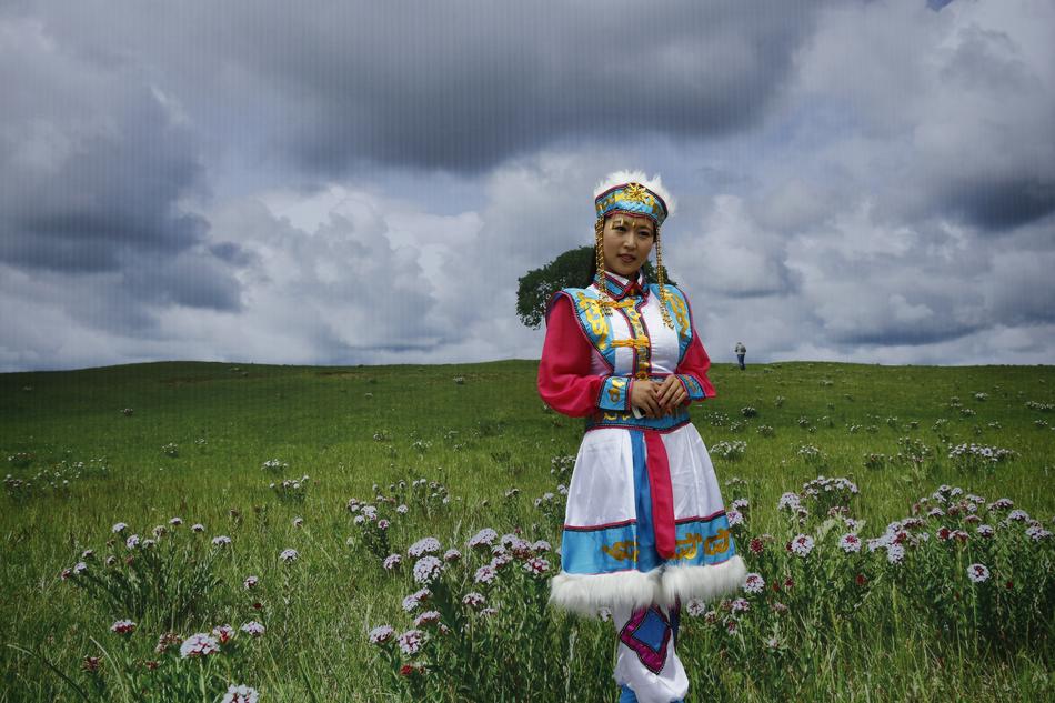 girl in folk costume at scenic landscape, Mongolia