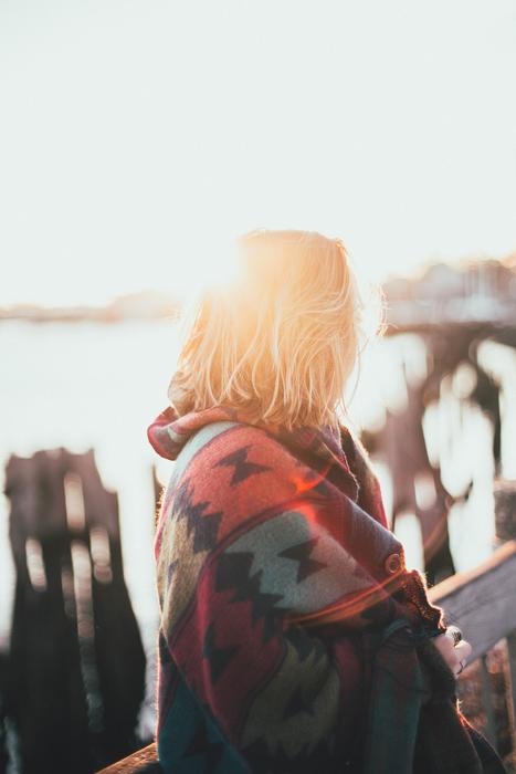 woman in coat at dawn