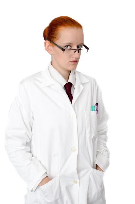 woman with glasses and doctor's coat
