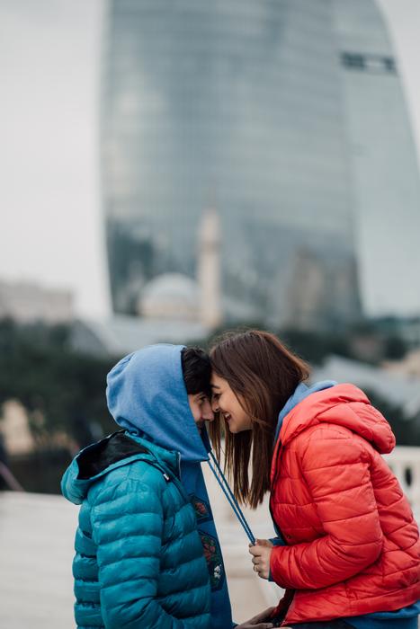 People in love, in front of the city