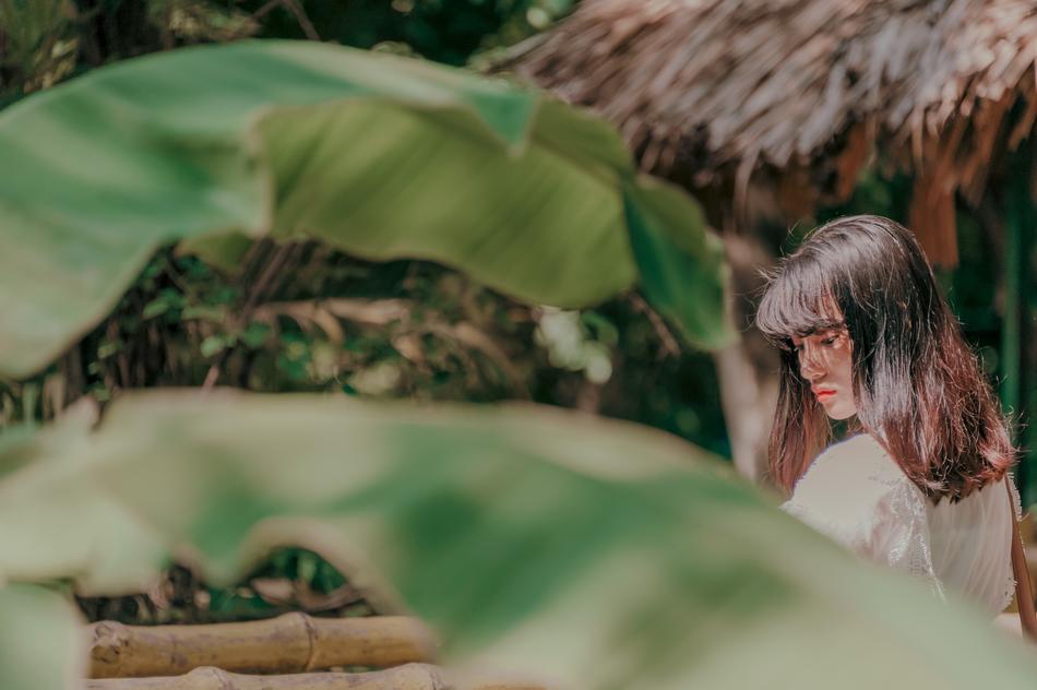 asian Beautiful Girl among tropical plants