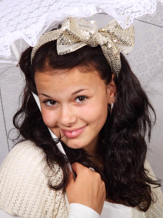 smiling girl with a shiny bow