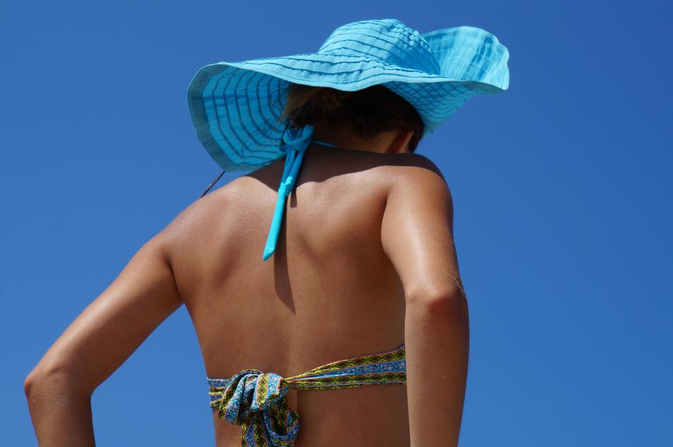Girl with hat at hot day