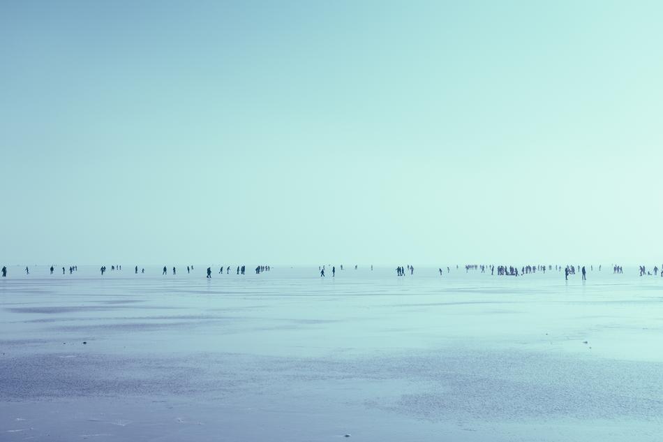 people on the frozen lake