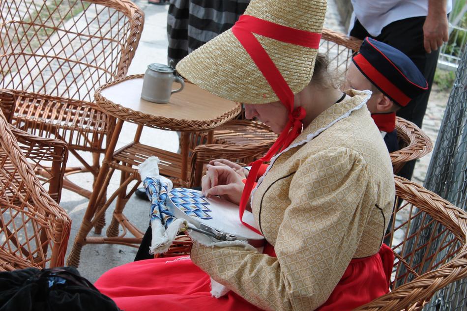 Embroider, woman in vintage clothing at work, poland, poznan