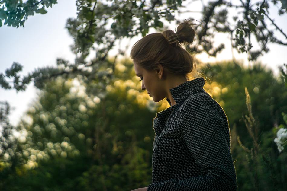 young Girl beneath tree at dusk