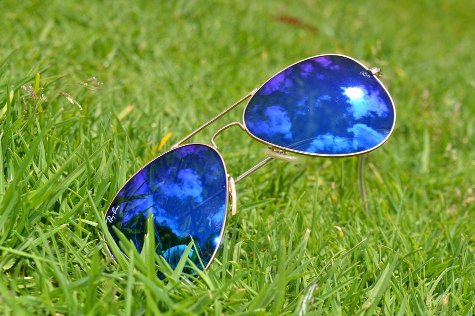 mirroring of sky on sunglasses on Lawn