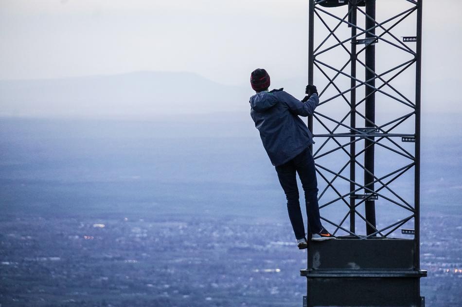 climbing woman on the high tower